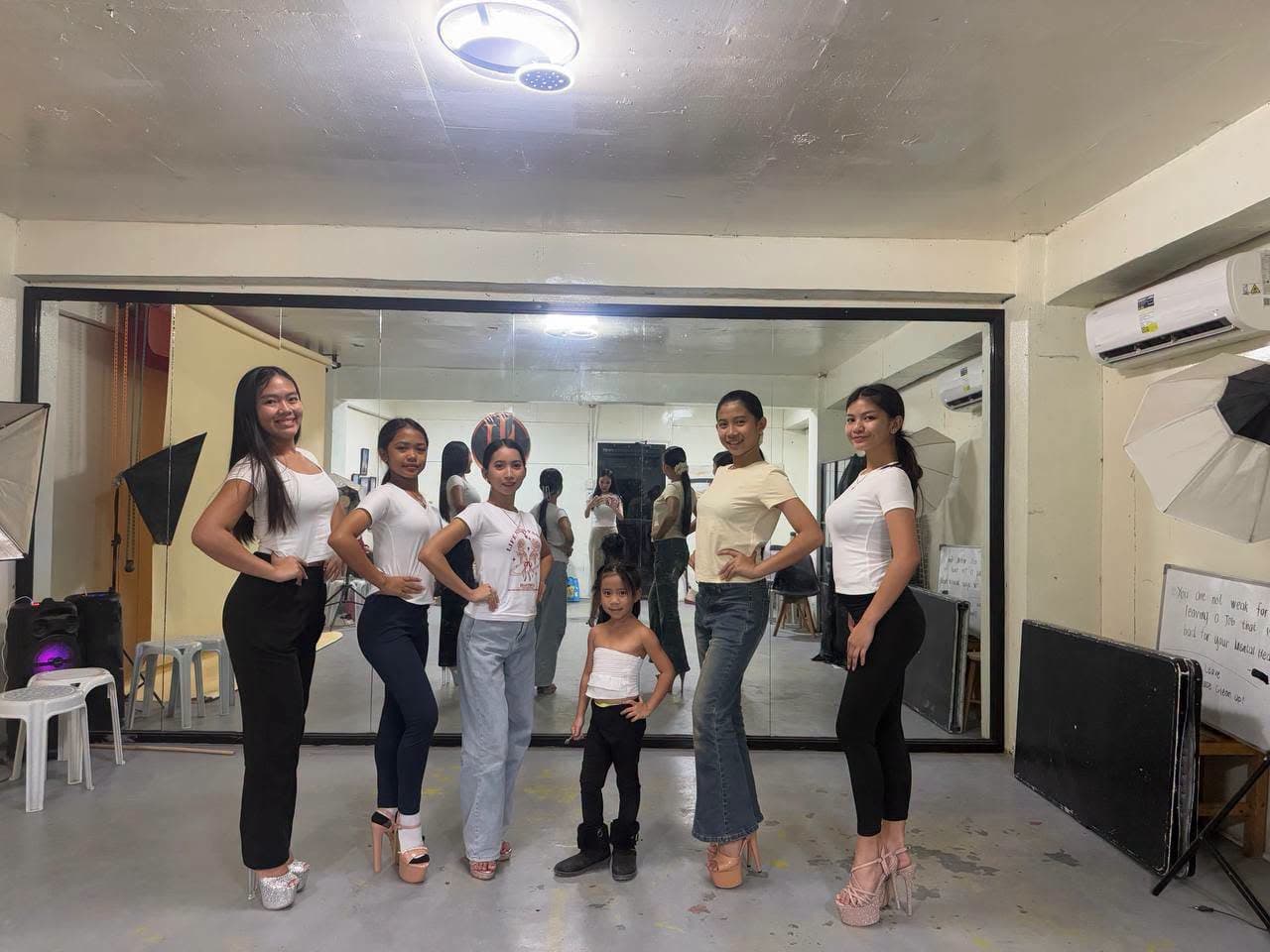 Jngels trainees practicing poses in the studio