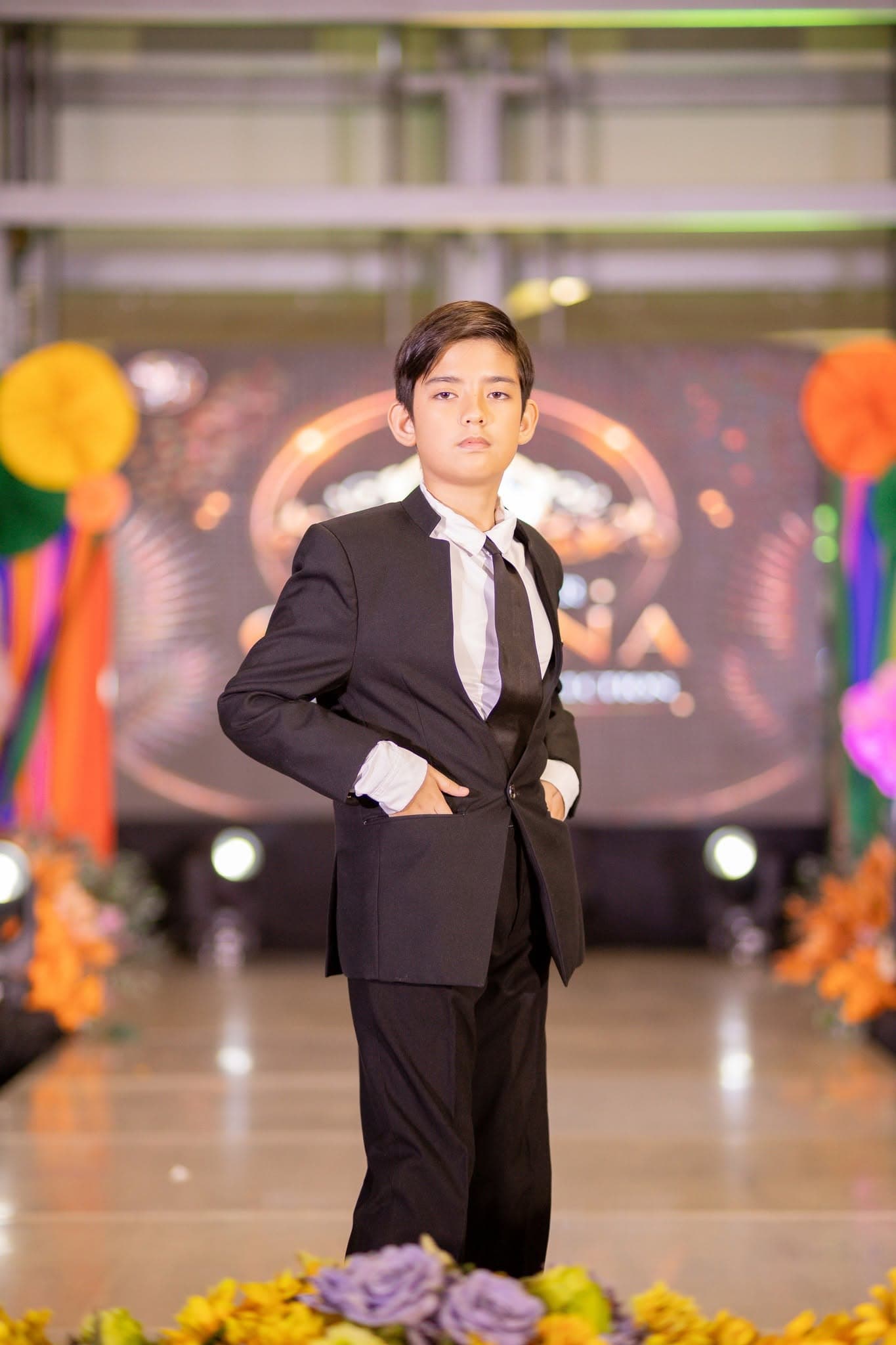 Young Jngels model in a formal suit on the runway
